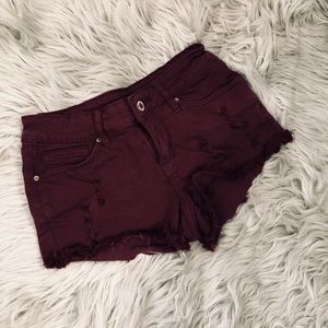 Maroon mini shorts.